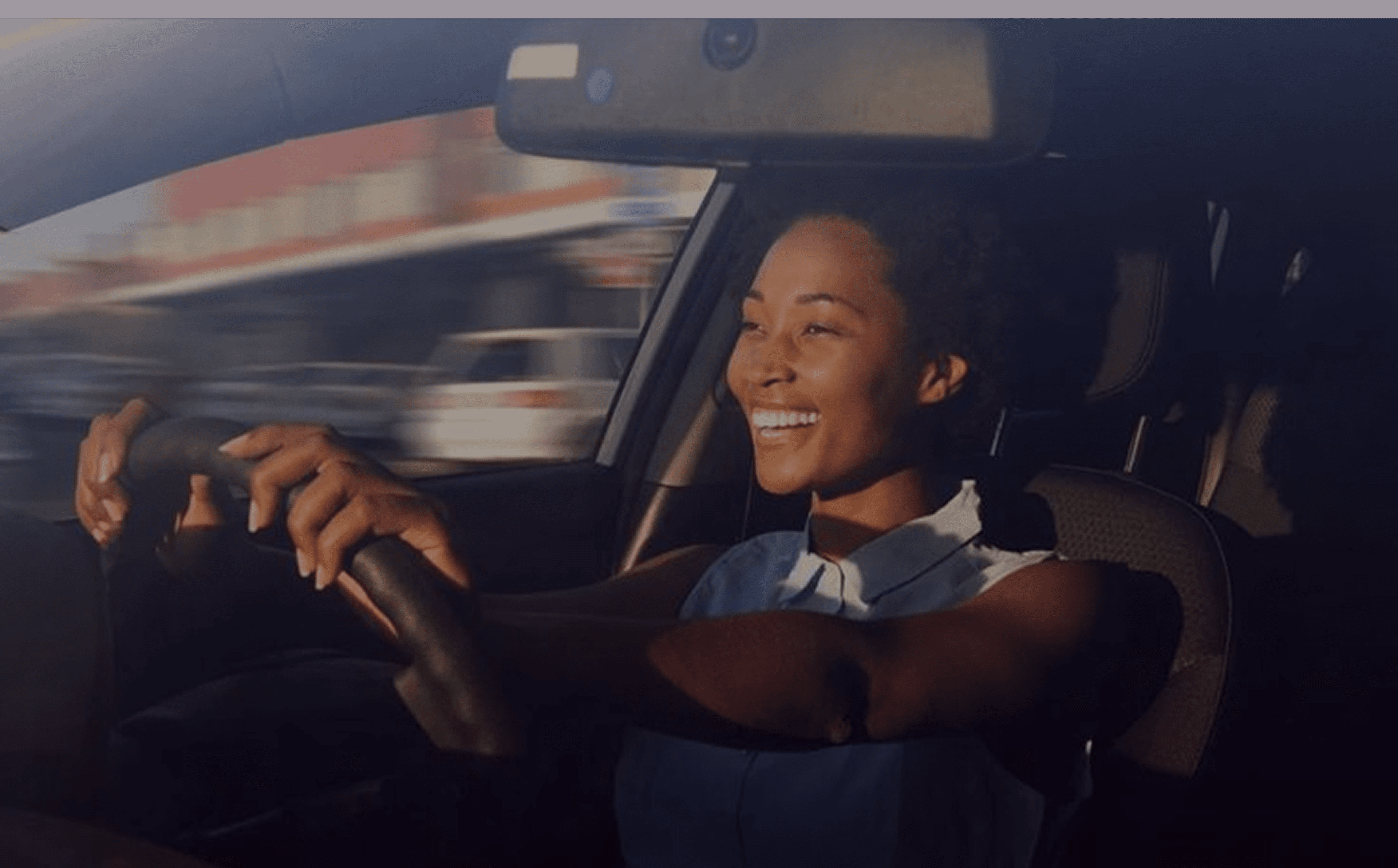 Woman confidently driving through the city