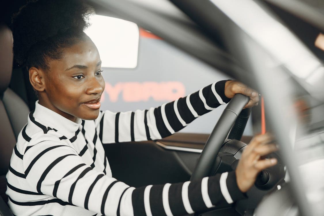 Woom Driver Academy graduate behind the wheel